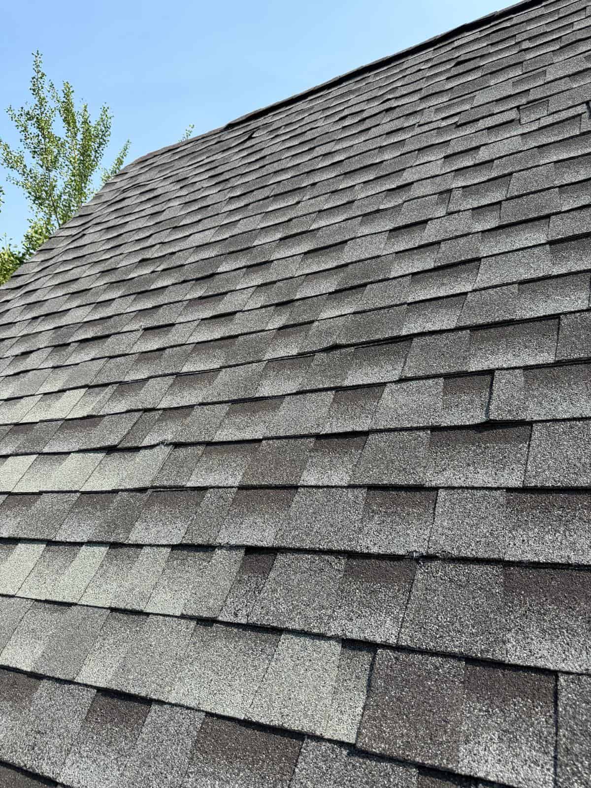 Close-up of new gray architectural asphalt shingles on a New Jersey roof